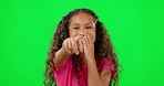 Girl child, green screen and laugh with point at you for comic joke, bullying or funny in studio mockup. Young female kid, secret and crazy laughing with pointing, choice or comedy with happy smile