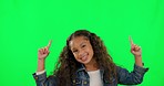 Green screen, face and happy kid pointing up in studio for promotion, announcement or deal. Portrait, smile and finger sign for information, choice or decision, notification or news, alert or sale