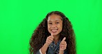 Happy little girl, dance and thumbs up on green screen for winning or celebration against a studio background. Excited female person, child or kid dancing with thumb emoji, yes sign or like on mockup