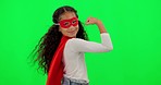 Girl child, superhero and green screen with strong arm, muscle and flex with smile on face for mockup. Young female kid, power and portrait with hero mask, red cape or stop crime by studio background
