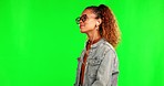 Green screen, happy and woman with music to relax listening to song, audio and radio in studio. Earphones, headphones and female person on chromakey background for streaming track, podcast and sound