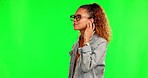 Green screen, music and woman with earphones to relax listening to song, audio and radio in studio. Happy, calm  and female person on chromakey background for streaming track, podcast and sound  