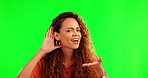 Woman, listening and hand by ear by green screen with face, question or doubt for gossip, story or news. Student girl, hearing or confused for answer, information or conversation by studio background