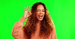 Happy woman, hair and smile with okay sign on green screen for casual fashion against a studio background. Portrait of female person smiling, OK hand gesture and wink for perfect hairstyle on mockup