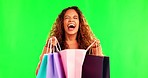 Happiness, excited woman on green screen with shopping bag and surprise for gift, reward or bonus gift with smile. Happy, screaming and surprised girl with paper bags, prize and deal at boutique sale