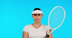 Woman, sports and portrait of tennis player in studio for wellness, training or competition on blue background. Female athlete, contest and fitness with racket, focus and gear or outfit for exercise