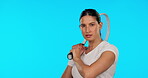 Face, tennis and confident woman with racket in studio isolated on a blue background mockup. Portrait, racquet sports or serious female athlete from Brazil ready to start exercise, workout or fitness