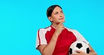 Young woman, football and thinking with ideas, vision and for career, mindset and portrait by blue background. Girl, soccer player and professional sports person with focus, choice and dream on brain