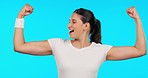Woman, face and fitness with flex, strong arms or muscle for smile, excited or pride by blue background. Girl bodybuilder, happy and body development with comic laughing for success, exercise or goal