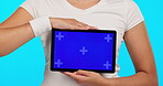 Mockup, sports branding and hands with a tablet for information, fitness announcement or advertising. Tracking markers, sport space and a person with a technology screen isolated on a blue background