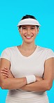 Tennis player, woman and smile on face in studio with arms crossed, confident and happy by blue background. Girl, athlete and sportswear for training, fitness or exercise for wellness, health or game