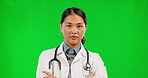 Doctor, face and woman with arms crossed on green screen for healthcare mindset, confidence and serious. Portrait, medical professional or asian person, proud for career in hospital or clinic service