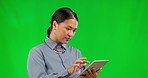 Green screen, glitch and Asian woman with a tablet, stress and frustrated employee against a studio background. Female person, web designer and consultant with technology, error and connection issue