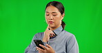 Phone, thinking and woman on green screen typing an idea, question or decision on social media, web or mobile app. Person, smartphone and search online for information, technology and communication