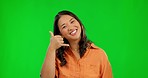 Face, green screen and Asian woman with hand gesture, phone call and communication against a studio background. Portrait, female person and model with emoji, telephone sign and symbol with happiness