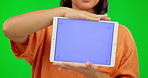 Chroma key, woman and hands on tablet for advertising, marketing or promotion on green screen for business, announcement. Technology, display and digital branding for online, web or mobile app 