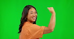 Face, woman and flex arm on green screen in studio isolated on a background. Portrait, strong muscle and Asian person with power, empowerment and pride for strength, gender equality and funny mockup.