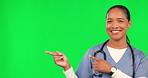 Nurse, healthcare and woman pointing finger on green screen for advertising choice or decision. Female doctor portrait with hand sign for marketing medicine, care or surgery and good review in studio