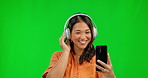 Music headphones, selfie and woman on green screen in studio isolated on a background mockup space. Smile, taking photo and Asian person on social media, profile picture or happy memory of influencer