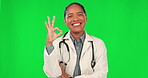 Okay hands, doctor and woman on green screen in healthcare success, support or excellence of services. Happy face of medical person or latino nurse in like, good job or yes hands on studio background