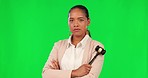 Confidence, face and female judge with a gavel in a studio with green screen ready for court case. Crossed arms, portrait and professional woman lawyer with a hammer isolated by chroma key background