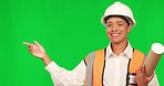 Architect woman, pointing and face by green screen, smile or choice on list for promo, plan or mockup space. Architecture expert, decision or checklist in construction, real estate or studio portrait