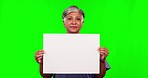 Sign, woman and doctor in a studio with green screen for marketing, advertising or promotion. Professional, portrait and senior female nurse with a board with mockup space by a chroma key background.