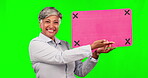 Business, green screen and a woman show speech bubble for announcement, voice or news. Portrait of happy mature person with blank poster board laughing for funny mockup comment or tracking markers
