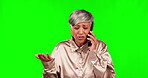 Phone call, fighting and frustrated with a woman on a green screen background in studio arguing on a telephone. Stress, conflict or problem with a senior employee looking angry during a conversation