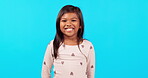 Emoji, smile and face of girl in studio with happiness, excited  and young children on blue background mockup. Portrait, happy and positive expression for chroma key announcement, promotion or sale