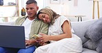 Laptop, phone and happy couple on sofa in home living room, bonding or having fun. Computer, relax and man and woman smile while streaming movie, video or typing email online on social media together