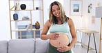 Pregnant woman portrait, stomach massage and happy at home with baby love, support and relax care. Young female person, belly development and mom smile with maternity and pregnancy in a living room