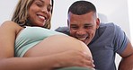 Couple, pregnant stomach and happy man by belly feeling silly with love at home. Marriage happiness, pregnancy and woman smile with family love, maternity support and tummy care for baby in a house