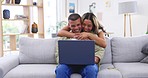 Laptop, hug and couple smile on sofa in home living room, bonding or having fun. Computer, relax and happy man and woman embrace while typing email, remote work and social media together in house.