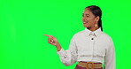 Happy woman, hands and pointing on green screen for advertising or marketing against a studio background. Portrait of female person point finger or showing advertisement, deal or news on mockup space