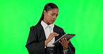 Tablet, green screen and legal with woman judge in studio reading information, law research or legislation for a trial. Technology, court and government with a magistrate thinking on chromakey mockup