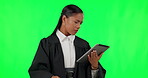 Tablet, green screen and government with woman judge in studio reading legal information, research or legislation for a trial. Technology, court and law with a magistrate thinking on chromakey mockup