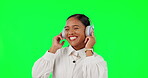 Happy woman, headphones and listening to music in dance on green screen against a studio background. Female person with smile and headset in happiness enjoying audio streaming or online sound track