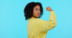 Power, woman flex her muscles and against a green screen happy for achievement. Empowerment or motivation, mockup space or strong and female person pose for gender equality or strength with a smile