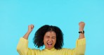 Woman, celebration and cheers, excited and winning fist pump, yes and happiness isolated on blue background. Happy female person, winner of reward or bonus, celebrate achievement and mockup space