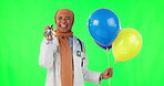 Party, balloons and doctor with face of muslim woman on green screen for celebration, birthday and success. Medical, medicine and healthcare with portrait of person on studio background for event