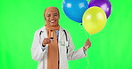 Party, balloons and medical with face of muslim woman on green screen for celebration, birthday and success. Doctor, medicine and healthcare with portrait of person on studio background for event