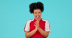 Happy, woman clapping her hands and celebrating against a blue background for success with sports tshirt. Achievement or winner, applause or good news and female person clap for congratulations 