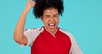 Soccer, face and woman winning, cheering and celebration in studio with good news, score or results on blue background. Football, portrait and happy female player with sports achievement or success