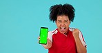 Celebration, green screen phone or woman excited for news, studio sales discount or prize giveaway. Competition winner, celebrate and portrait person shout, cheers and fist pump on blue background