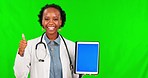 Black woman, doctor and thumbs up with tablet on green screen for success against a studio background. Portrait of African female person in healthcare with technology mockup, like emoji or yes sign