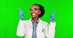 Black woman, scientist and pointing up on green screen for advertising against a studio background. Portrait of African female person in science with finger point for advertisement on mockup space