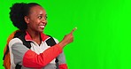 Green screen, black woman and pointing at travel list for advertising, hiking promo on studio background. Smile, marketing and mockup space, holiday discount information and female hiker in portrait