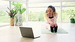 Laptop, forward stretching and woman in home for exercise, fitness or holistic training. Computer, yoga and female person in pose streaming pilates video, online class or tutorial for healthy body.