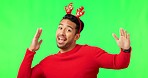 Man, dancing and Christmas hat by green screen, comic face or funny in holiday fashion, smile or mockup space. Guy, dancer and xmas clothes for festive celebration, milly rock and ideas by background